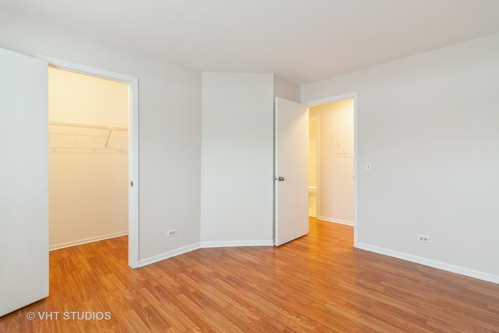 1352 McDowell Road, Unit 103 Naperville, IL 60563 - Photo 10 of 12 a view of an empty room and wooden floor