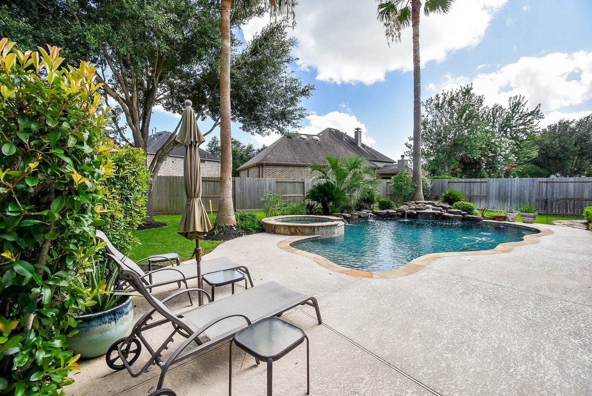 27607 Macklind Ridge Lane Katy, TX 77494 - Photo 11 of 50 Lounging area with built in umbrella hole. Pretty private back yard.