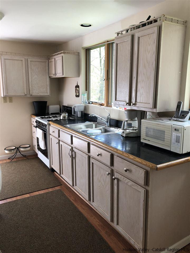 608 Cartwright Road Roxbury, NY 12421 - Photo 4 of 17 a kitchen with stainless steel appliances granite countertop a sink stove and cabinets