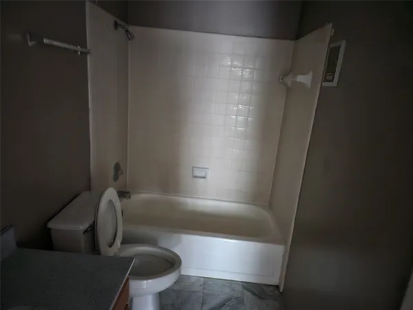 a bathroom with a tub and a shower