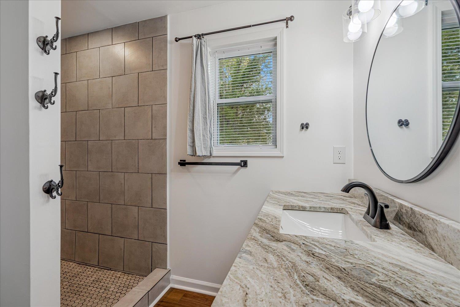 8371 McCalla Road Millington, TN 38053 - Photo 23 of 27 Bathroom with a stall shower, vanity, and dark wood-style floors