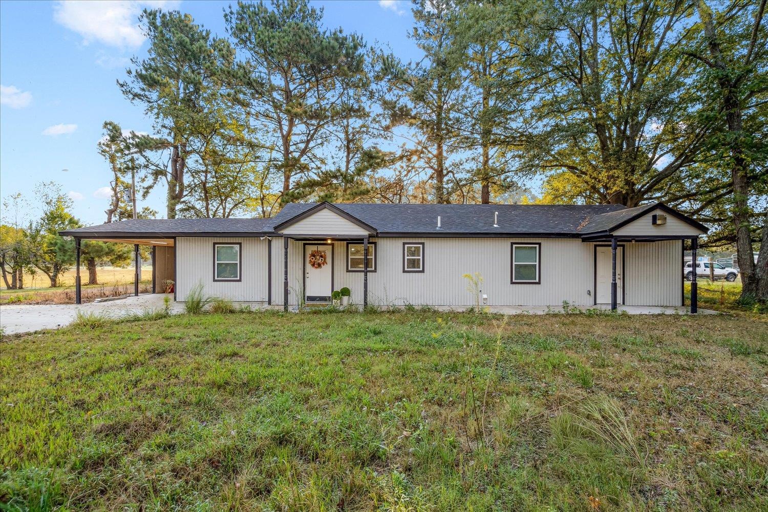 8371 McCalla Road Millington, TN 38053 - Photo 27 of 27 Single story home featuring a carport, a front lawn, and a shingled roof