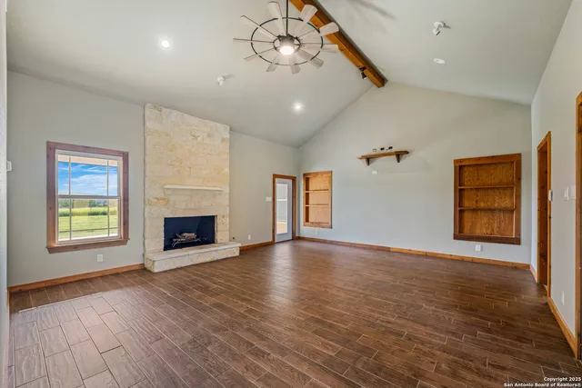 a bathroom with a toilet a sink a vanity and mirror