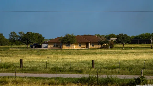 a view of a yard with an outdoor space