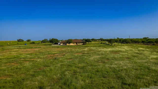 a view of a backyard of the house