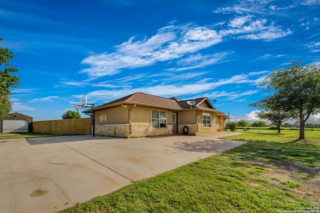a house view with a garden space