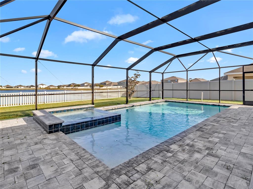 5446 Logan Cave Avenue Wimauma, FL 33598 - Photo 25 of 57 a view of a backyard of a house