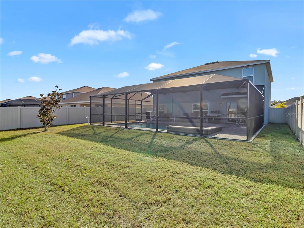 5446 Logan Cave Avenue Wimauma, FL 33598 - Photo 29 of 57 a view of a backyard