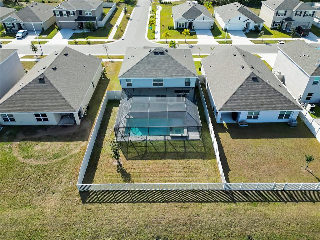 5446 Logan Cave Avenue Wimauma, FL 33598 - Photo 52 of 57 a aerial view of a house with swimming pool