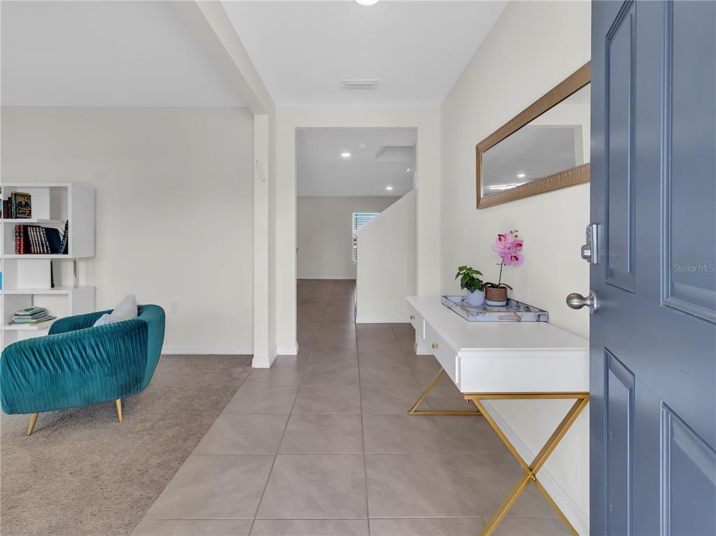 5446 Logan Cave Avenue Wimauma, FL 33598 - Photo 8 of 57 a bathroom with a tub sink and mirror