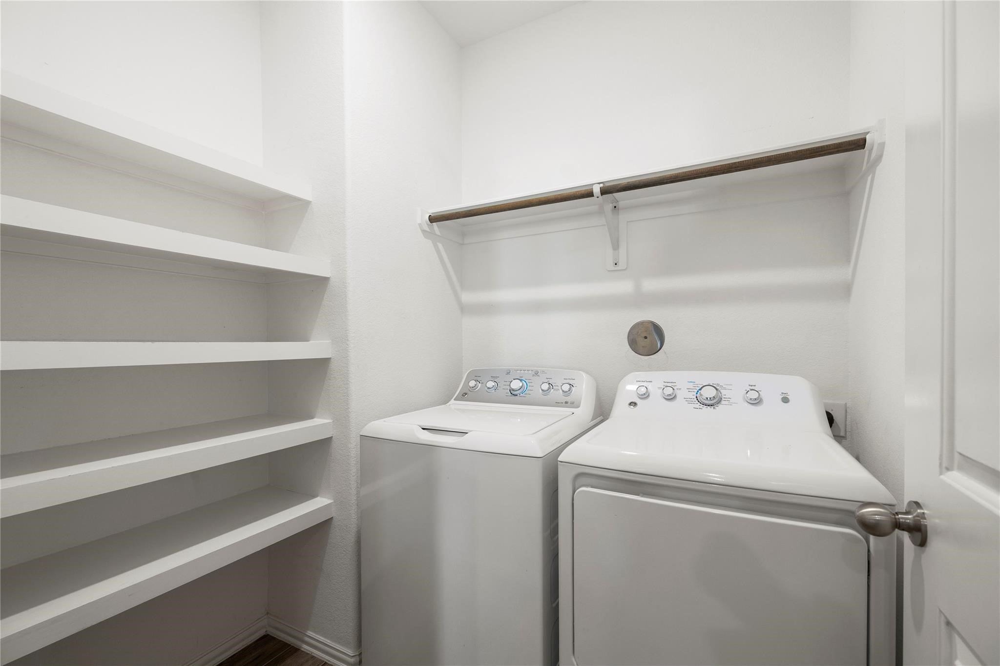 29507 Whitebrush Trace Drive Spring, TX 77386 - Photo 5 of 32 Laundry area with washer, dryer, and built-in shelving.