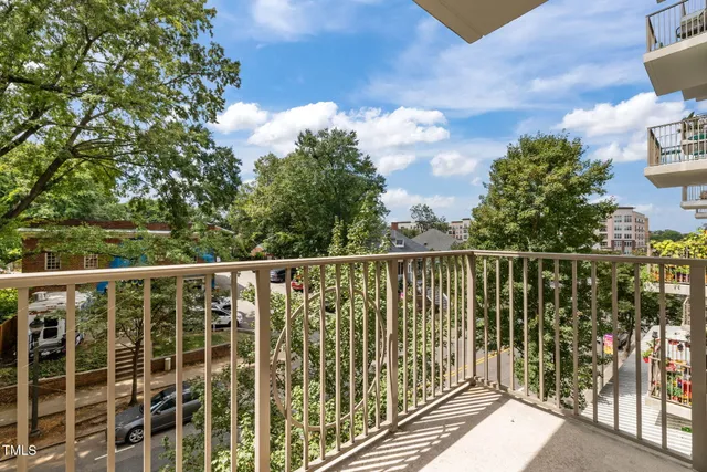 a balcony with wooden floor