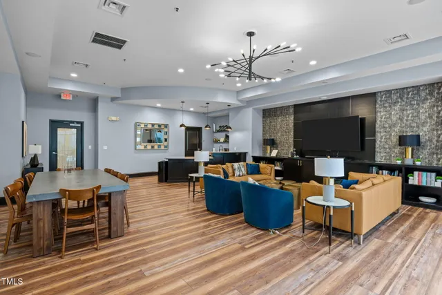 an aerial view of a house with balcony and garden