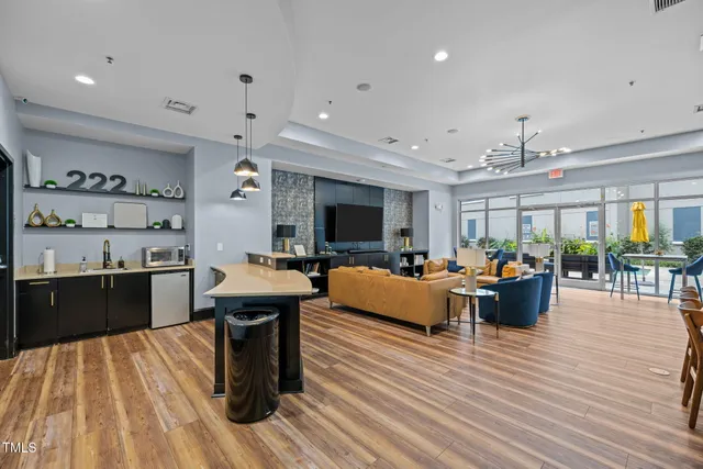 a view of a swimming pool with outdoor seating