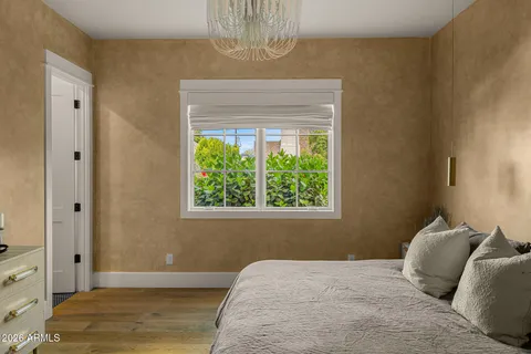 a bedroom with a bed and couch