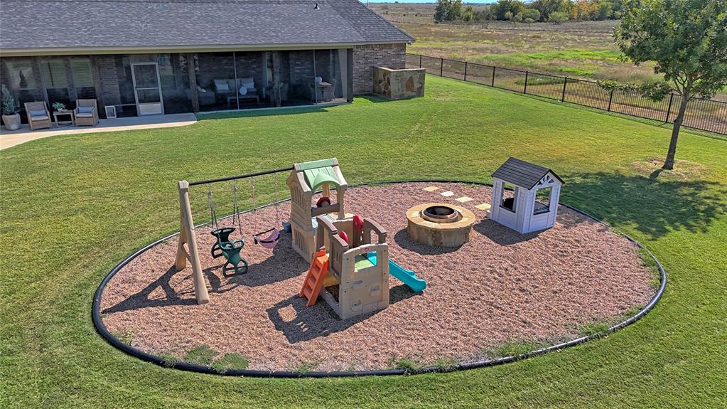 1150 Lone Star Road Bowie, TX 76230 - Photo 13 of 35 a view of a house with a yard