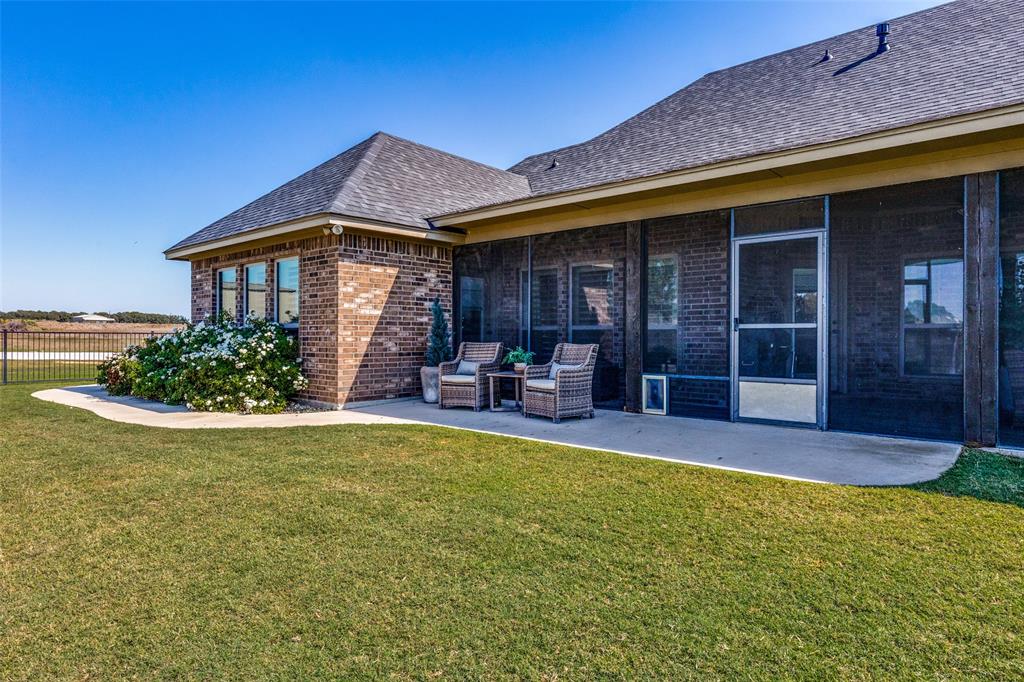 1150 Lone Star Road Bowie, TX 76230 - Photo 3 of 35 a view of a house with swimming pool and porch