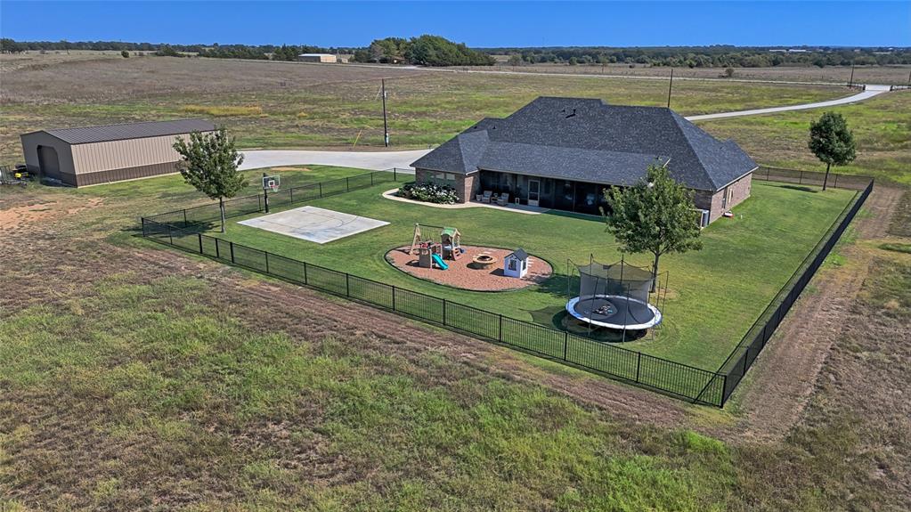 1150 Lone Star Road Bowie, TX 76230 - Photo 4 of 35 an aerial view of a house with outdoor space and lake view