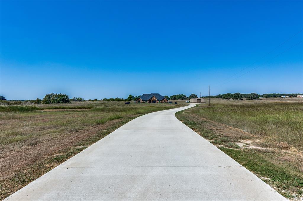 1150 Lone Star Road Bowie, TX 76230 - Photo 8 of 35 a view of a lake with a big yard