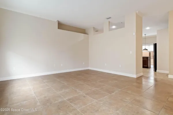 a view of an empty room with glass door
