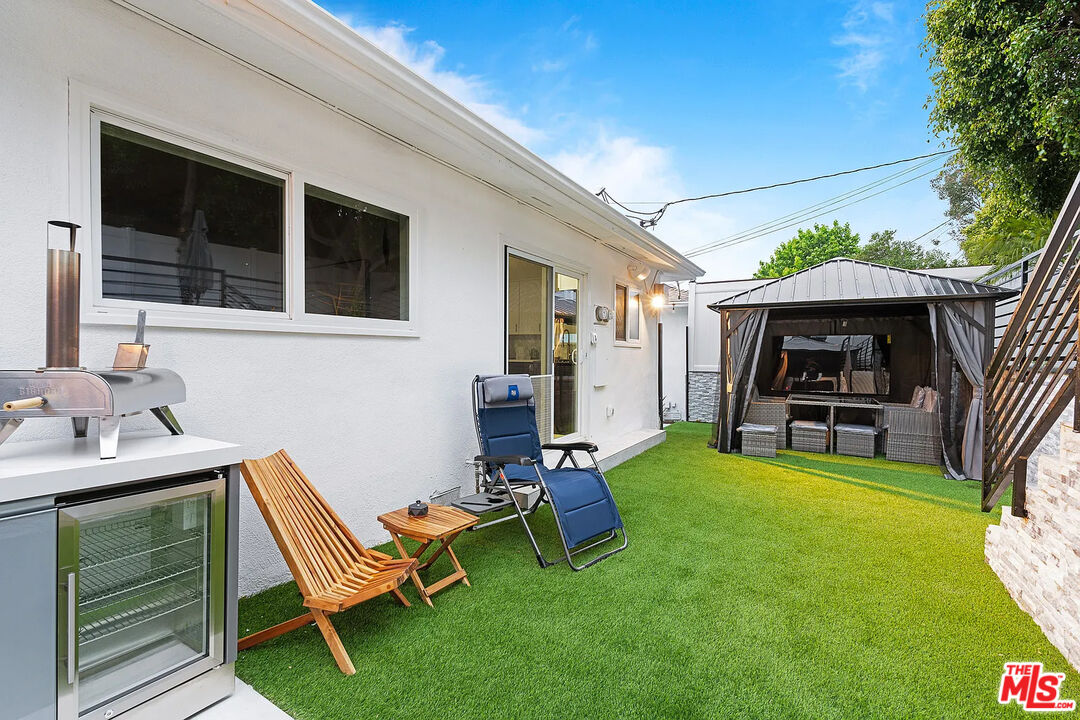 8222 Pershing Drive Playa del Rey, CA 90293 - Photo 12 of 36 a view of a house with backyard porch and sitting area