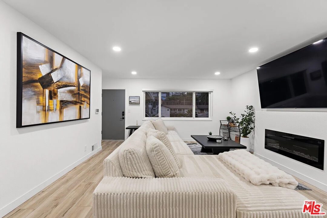 8222 Pershing Drive Playa del Rey, CA 90293 - Photo 14 of 36 a bedroom with a large bed and a flat screen tv