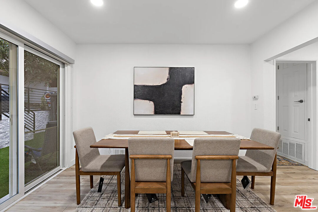8222 Pershing Drive Playa del Rey, CA 90293 - Photo 18 of 36 a view of a dining room with furniture and wooden floor