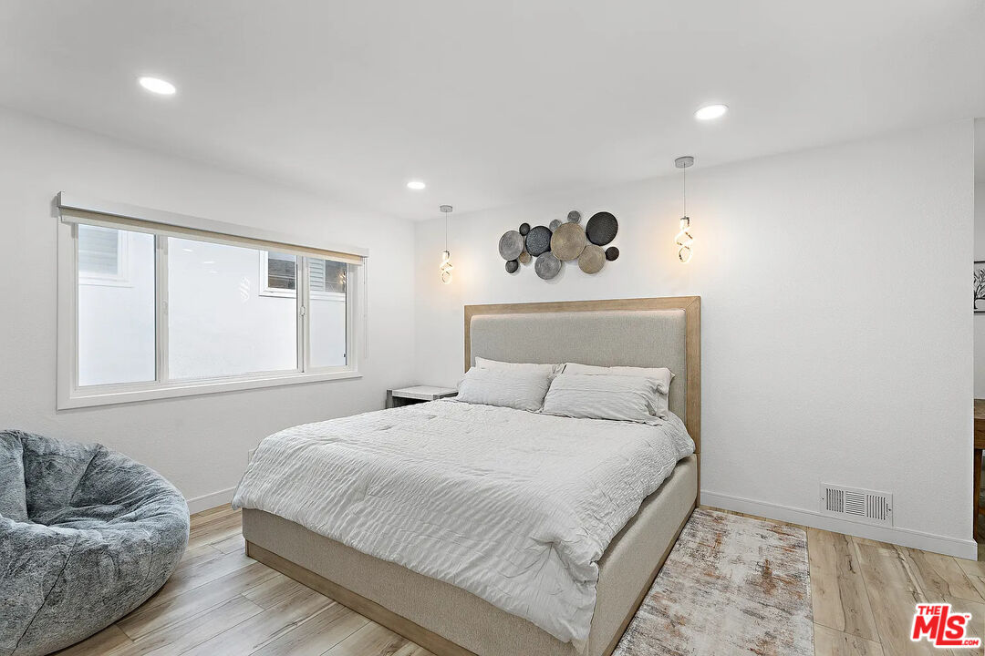 8222 Pershing Drive Playa del Rey, CA 90293 - Photo 23 of 36 a bedroom with a bed and window