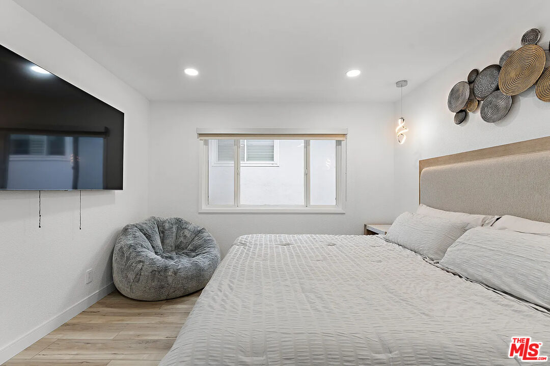 8222 Pershing Drive Playa del Rey, CA 90293 - Photo 25 of 36 a bedroom with a bed and window