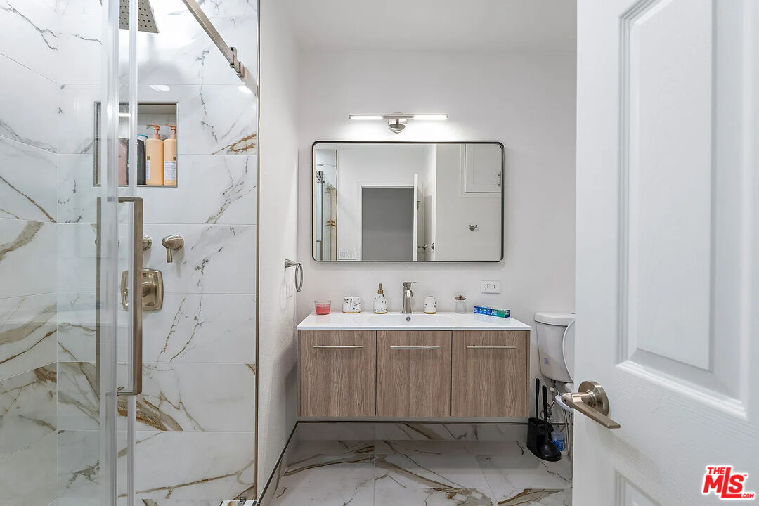 8222 Pershing Drive Playa del Rey, CA 90293 - Photo 30 of 36 a bathroom with a sink double vanity and a mirror