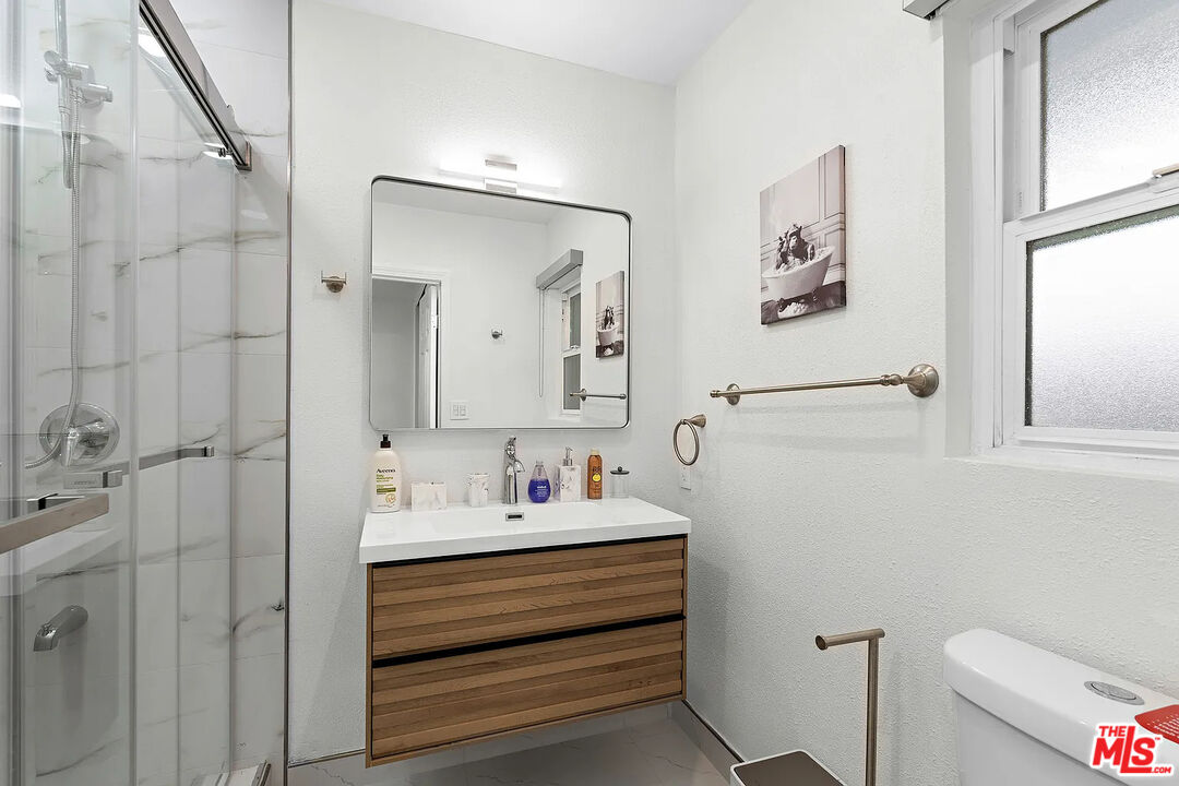 8222 Pershing Drive Playa del Rey, CA 90293 - Photo 31 of 36 a bathroom with a sink vanity and toilet
