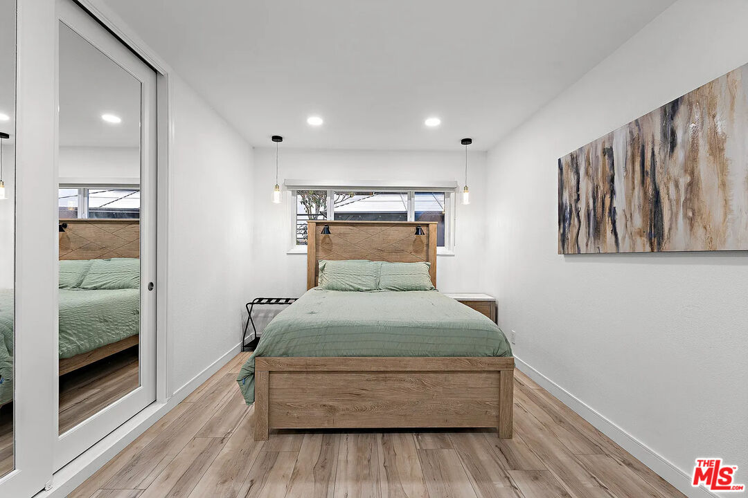 8222 Pershing Drive Playa del Rey, CA 90293 - Photo 32 of 36 a bedroom with a bed and a walk in closet
