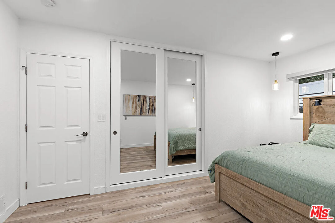 8222 Pershing Drive Playa del Rey, CA 90293 - Photo 33 of 36 a bedroom with a bed and a mirror