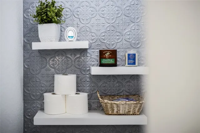 a room with a couch and a fireplace