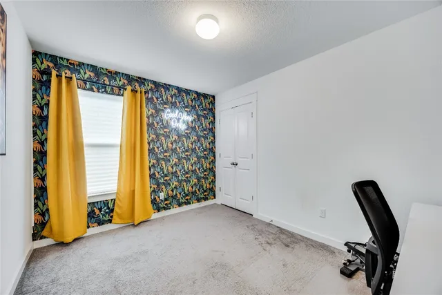 a view of room with window and bathroom