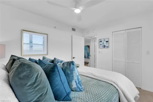 a bathroom with a sink a toilet and a large mirror