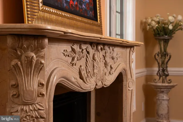 a living room with furniture fireplace and window