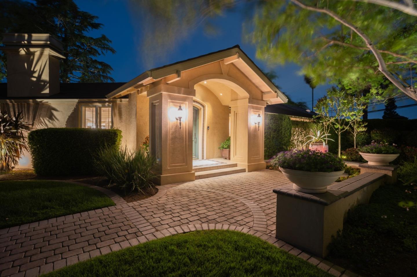 a front view of a house with garden