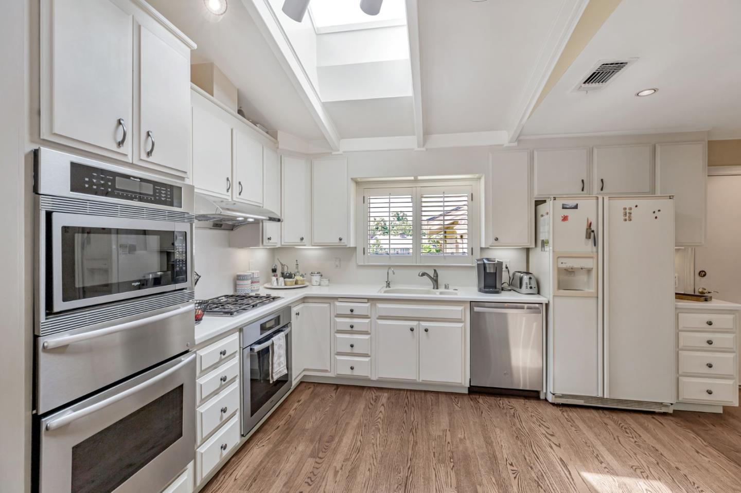 3231 Fieldcrest Drive Sacramento, CA 95821 - Photo 21 of 95 a kitchen with white cabinets and white appliances