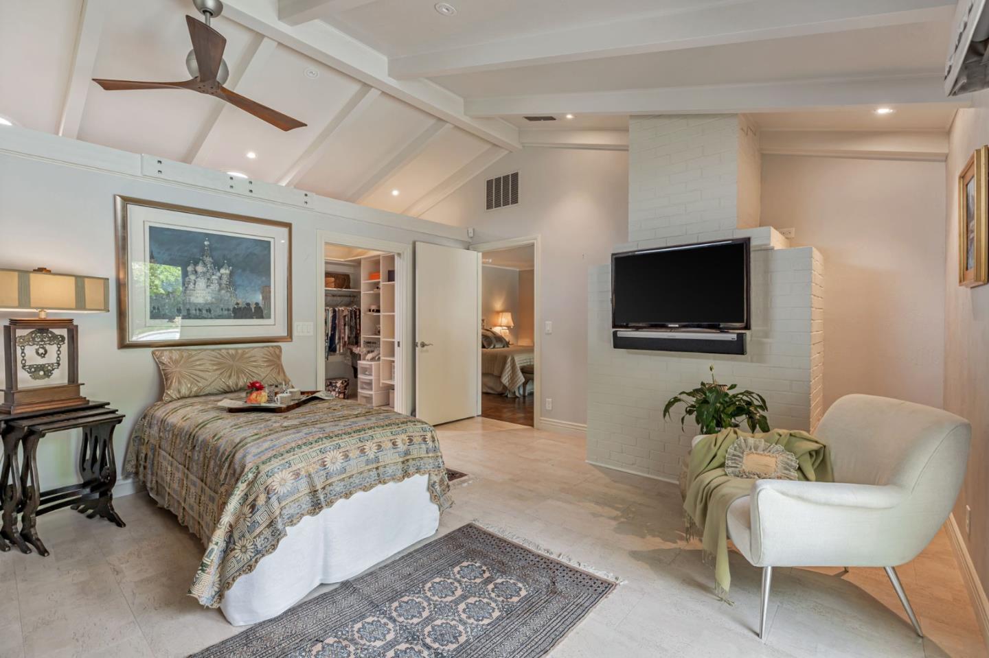 3231 Fieldcrest Drive Sacramento, CA 95821 - Photo 47 of 95 a spacious bedroom with a bed a couch and a flat screen tv