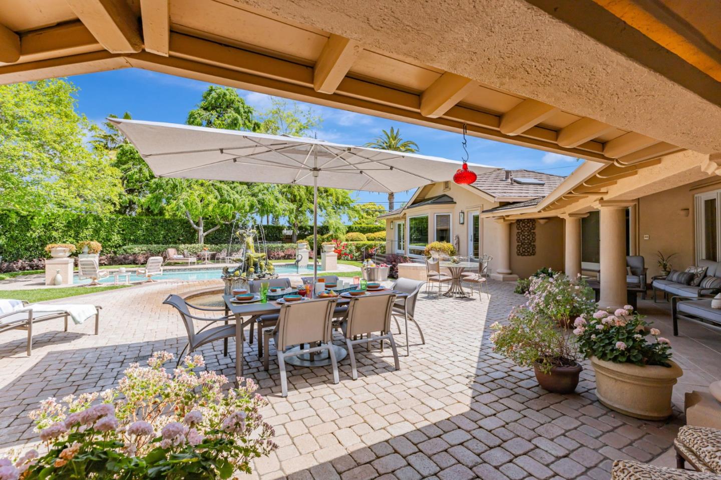 3231 Fieldcrest Drive Sacramento, CA 95821 - Photo 60 of 95 a view of a patio with a dining table and chairs and potted plants