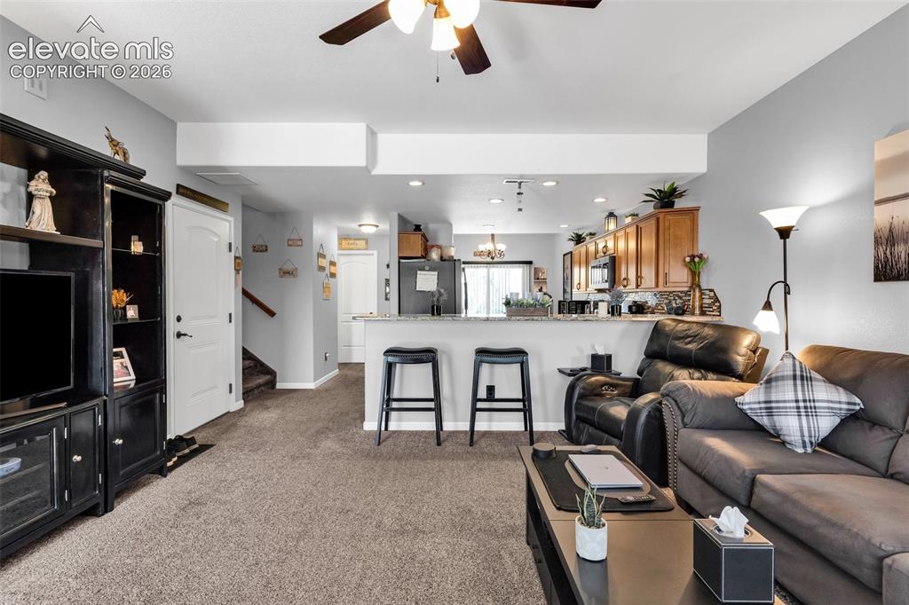 415 Empire Road Canon City, CO 81212 - Photo 10 of 40 a living room with furniture and a flat screen tv