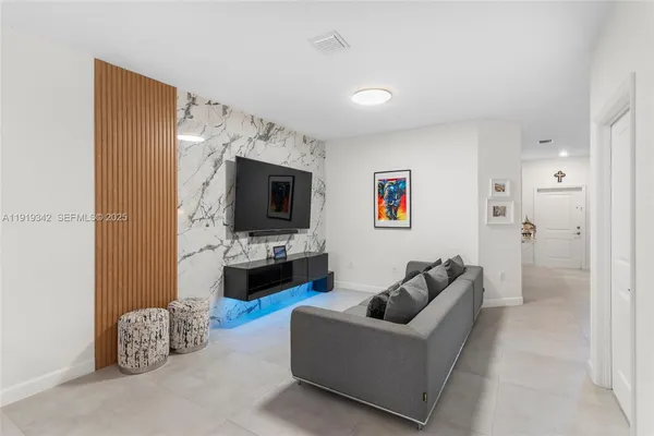 a kitchen with stainless steel appliances a refrigerator stove microwave and cabinets