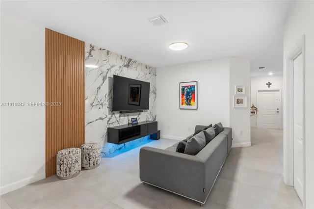 a kitchen with stainless steel appliances a refrigerator stove microwave and cabinets