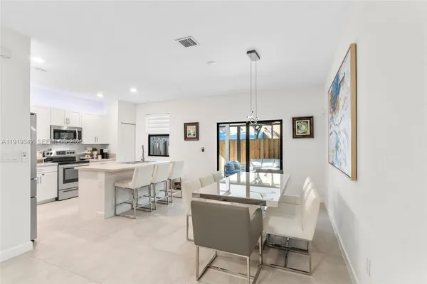 a view of a porch with furniture and garden