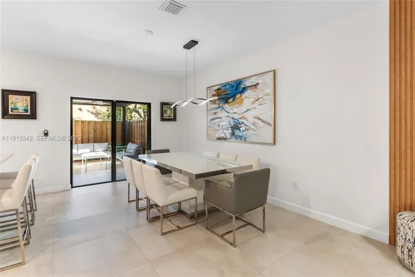 a bedroom with a bed and a tv