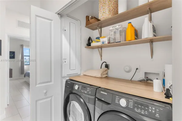a bedroom with a bed and flat screen tv