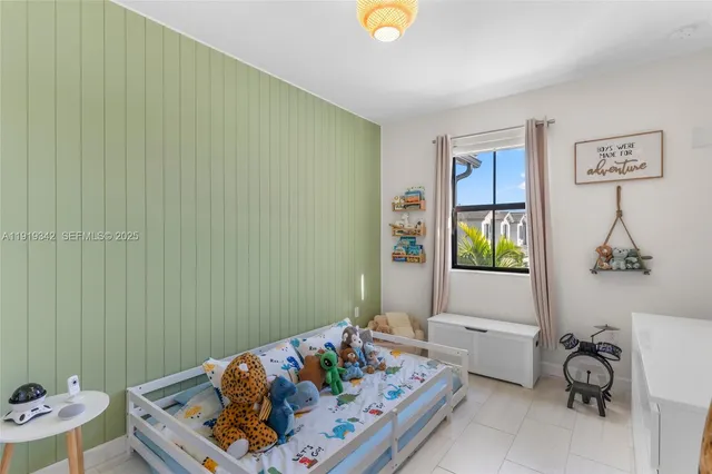 a bedroom with a bed and a table in it