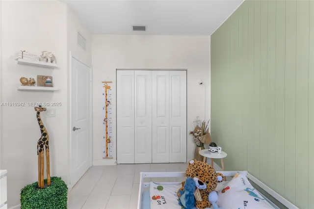 a view of a swimming pool with a yard and potted plants
