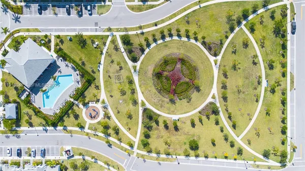 an aerial view of a house with a swimming pool